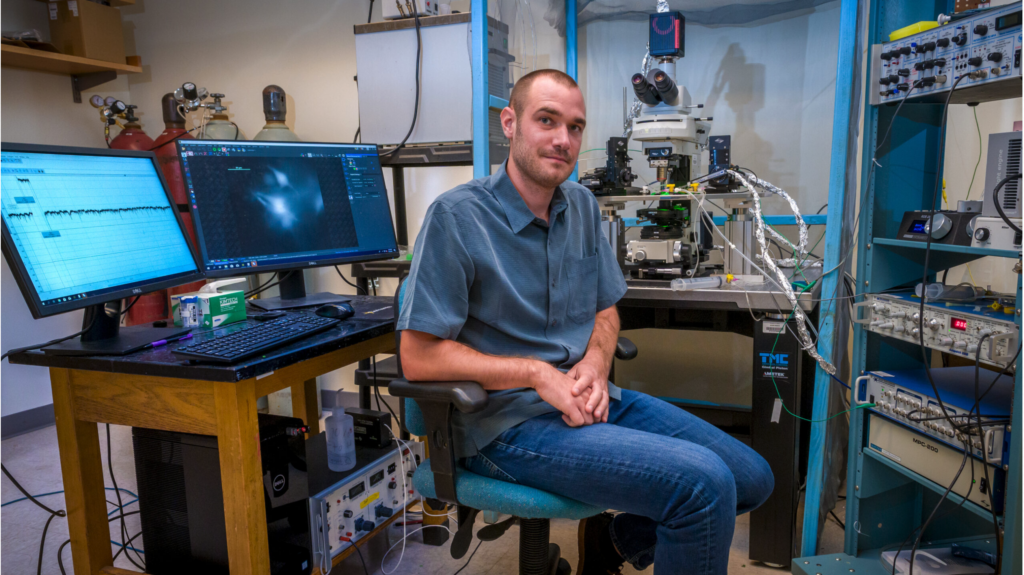 Joseph Santin at electrophysiology rig
